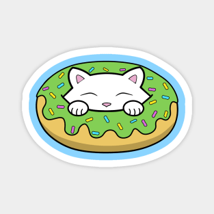 Cute kitten eating a green doughnut with sprinkles on top of it on St. Patrick's day Magnet