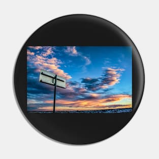 Metal Sign Against a Colorful Sky Pin