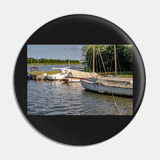 Boats moored on Hickling Broad in the Norfolk Broads National Park Pin