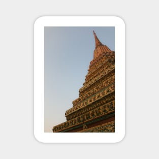 First unusual low angle view of a Buddha stupa against clear sky. Magnet