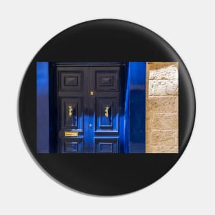 Blue wooden door with golden vintage knockers Pin