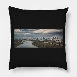Moody sky over distant city Pillow