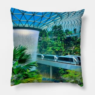 A roof waterfall with passing sky trains in Changi airport 1 Pillow