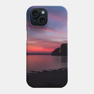 Silhouetted rock stack at a red sunset beach Phone Case