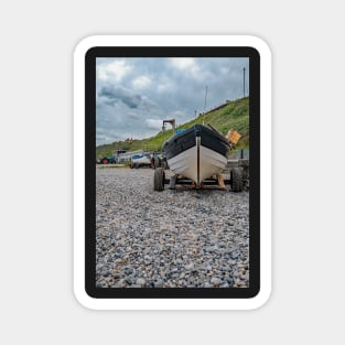 Front end view of fishing boat on the beach Magnet