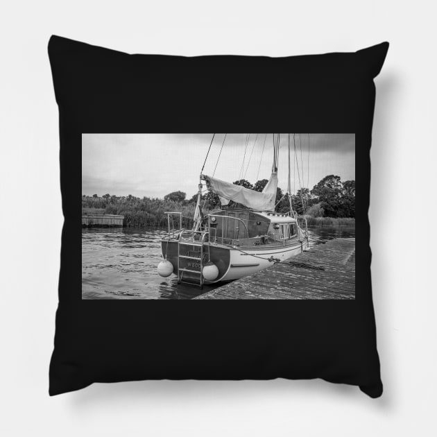 Traditional Broads boat moored to a wooden quay heading Pillow by yackers1