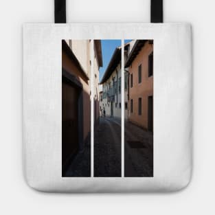 North Italy Life in the center of the lombard medieval city. Walking through narrow streets and walls. Sunny summer day. (vertical) Tote