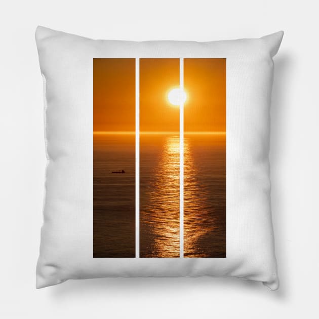 Wonderful landscapes in Norway. Nord-Norge. Beautiful scenery of a midnight sun sunset at Nordkapp (Cape North). Boat and globe on a cliff. Rippled sea and clear orange sky. (vertical) Pillow by fabbroni-art