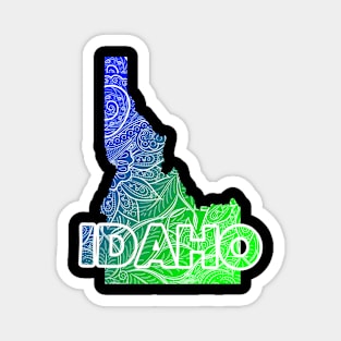 Colorful mandala art map of Idaho with text in blue and green Magnet