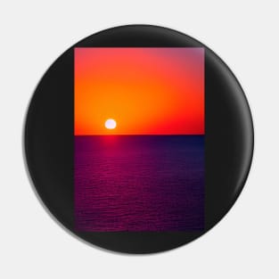 RED AND PURPLE SUNSET OVER THE OCEAN Pin