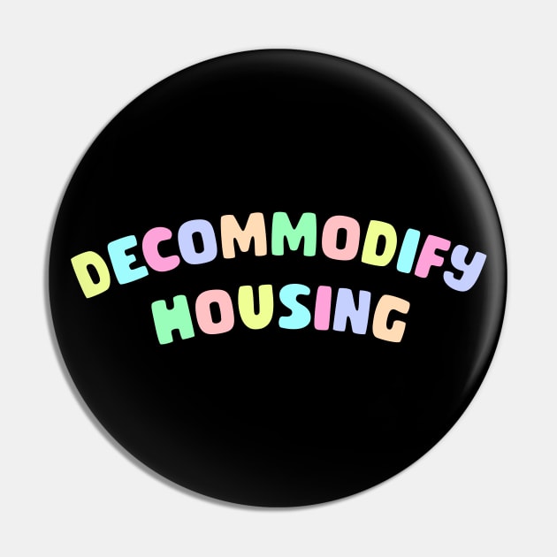 Decommodify Housing Pin by Football from the Left