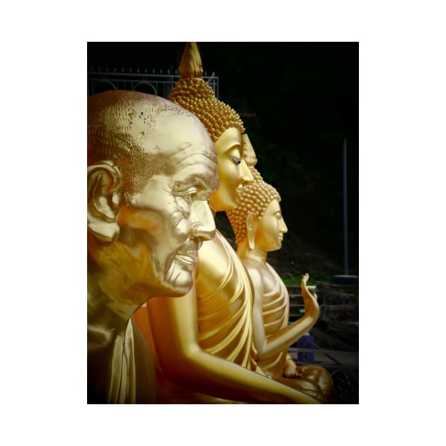 3 Buddhas seated, Thailand. One depicted as an old man. by JonDelorme