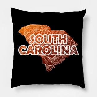 Colorful mandala art map of South Carolina with text in brown and orange Pillow