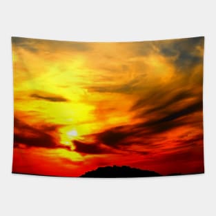 Apocalyptic scenery with a bath of violent clouds in the sunset sky full of raging red and yellow colours Tapestry