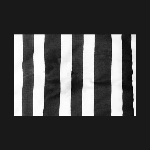 Black and white striped cloth laid out roughly to provide vetical blank lines. by brians101