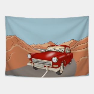 Red vintage car on the highway  in the desert and mountains. Tapestry