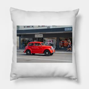 Red Morris 8 car in deco city of Napier New Zealand. Pillow