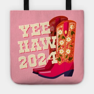 A pair of cowboy boots decorated with flowers and a hand lettering message Yeehaw 2024 on pink background. Happy New Year colorful hand drawn vector illustration in bright vibrant colors. Tote