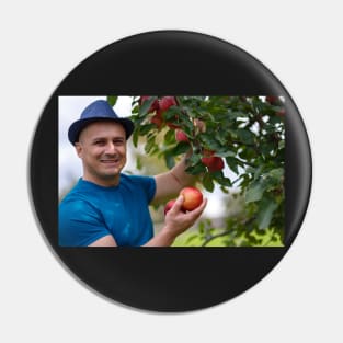 Gardener picking apples Pin