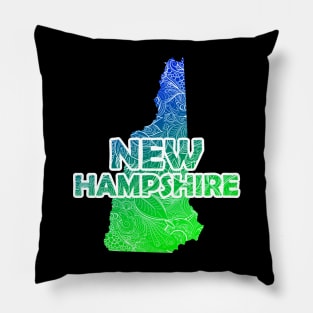 Colorful mandala art map of New Hampshire with text in blue and green Pillow