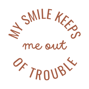 My smile keeps me out of trouble T-Shirt