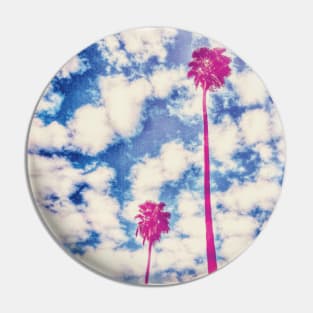 Pink Palm Trees Against a Cloudy Blue Sky Pin