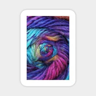 ball of coloured wool making a complex design structure on black background Magnet