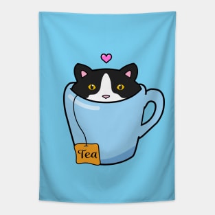 Sweet tuxedo cat sitting in a blue cup of tea Tapestry