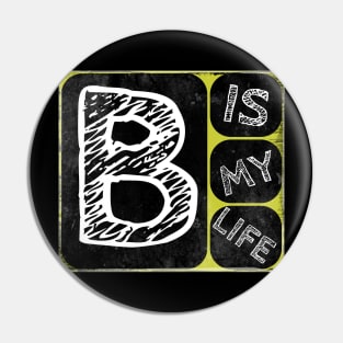 B t-shirt Pin