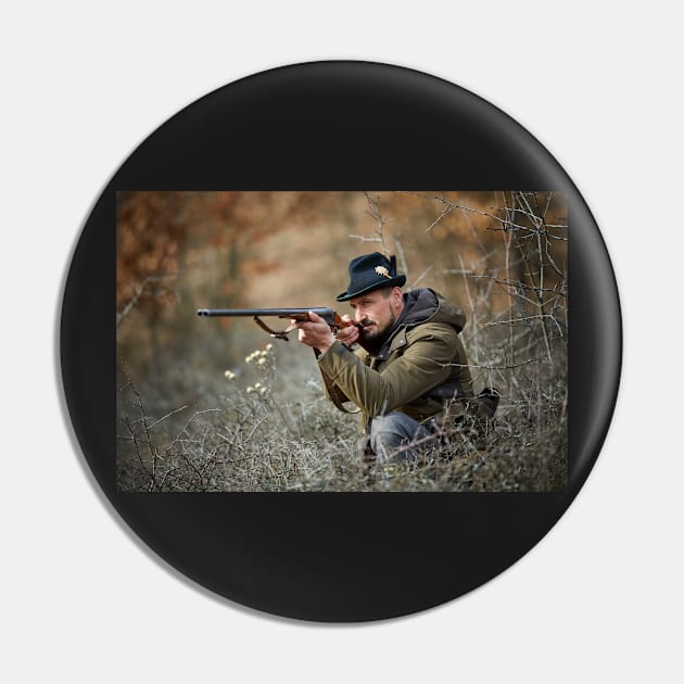 Hunter with gun in the forest Pin by naturalis