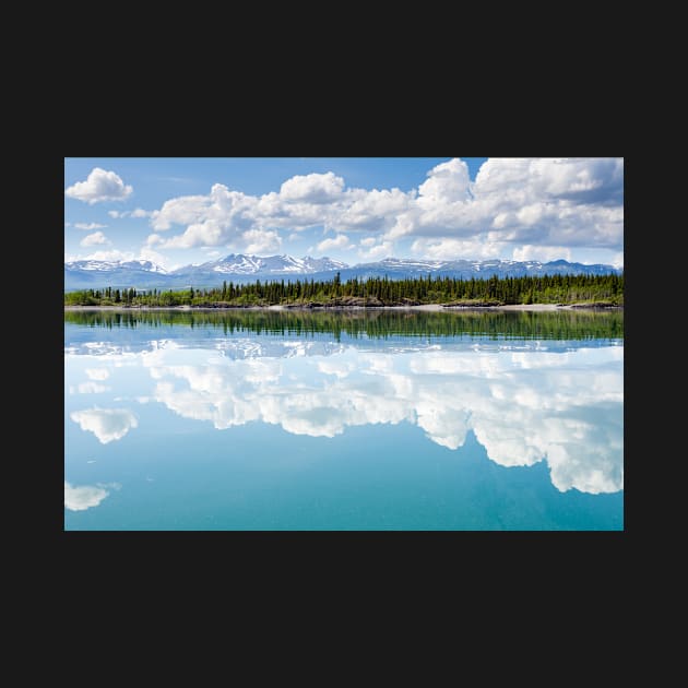 Yukon wilderness cloudscape reflected on calm lake by ImagoBorealis