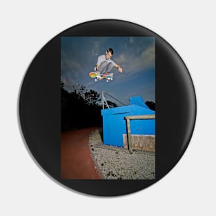 Skateboarder flying Pin