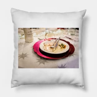 : An empty plate with only a little leftover crumbs, the empty wine glass has fallen over Pillow