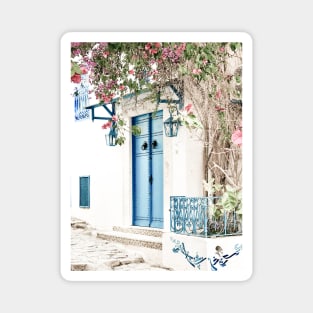 Blue door with pink blossom in Tunisia Magnet