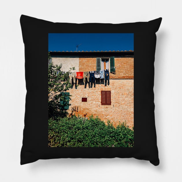 Laundry Drying on Washing Line Against Old Brick Building in Tuscany Italy Pillow by visualspectrum