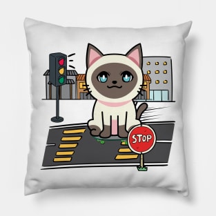 Cute Siamese cat is skate boarding on the street Pillow