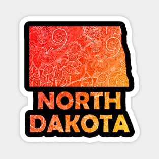 Colorful mandala art map of North Dakota with text in red and orange Magnet