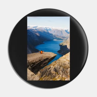 Man sitting on Trolltunga rock meditating Pin