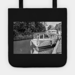 Front on view of holiday boat moored up on the Norfolk Broads Tote