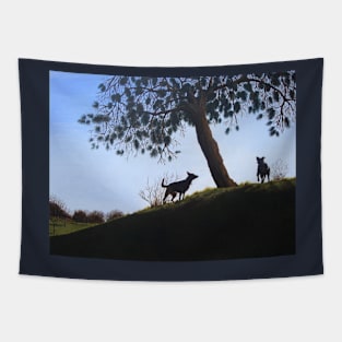 cone tree on hillside with dogs playing Tapestry