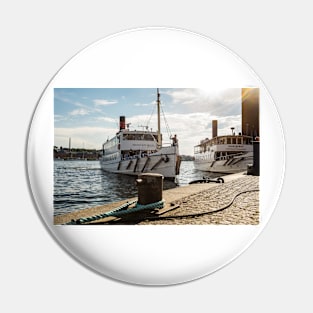 An old steamboat  in the Swedish archipelago arrives at the pier in Stockholm Pin