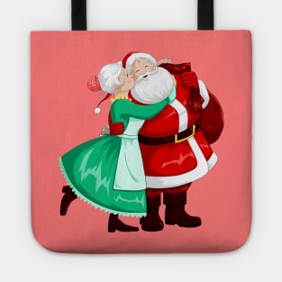 Mrs Claus Kisses Santa On Cheek And Hugs Tote