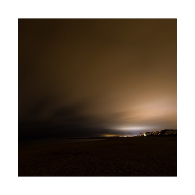 Beach of Carnon with an Illuminated Cloud Cover at Night by holgermader