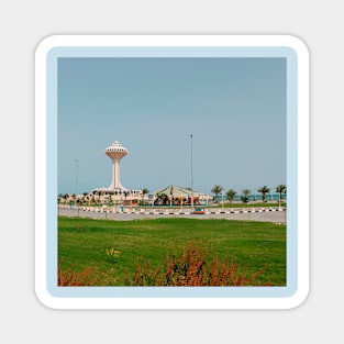 Lighthouse near blue ocean and green park with palm Magnet