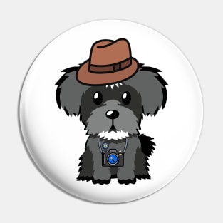 Funny schnauzer is holding a camera Pin