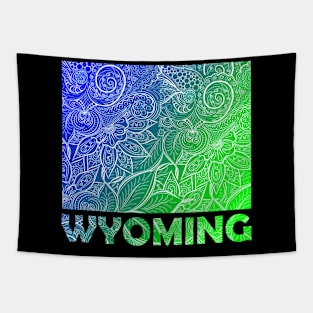 Colorful mandala art map of Wyoming with text in blue and green Tapestry