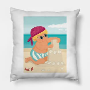 Cute little boy is on vacation building a sand castle on the beach Pillow