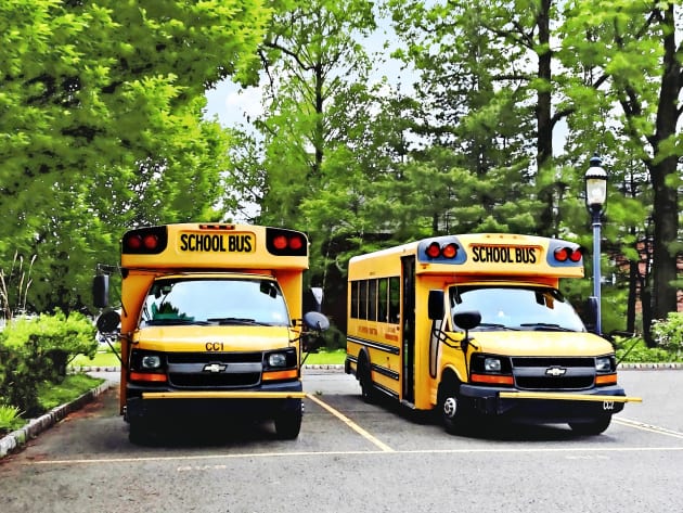 Teachers - Two Yellow School Buses Kids T-Shirt by SusanSavad