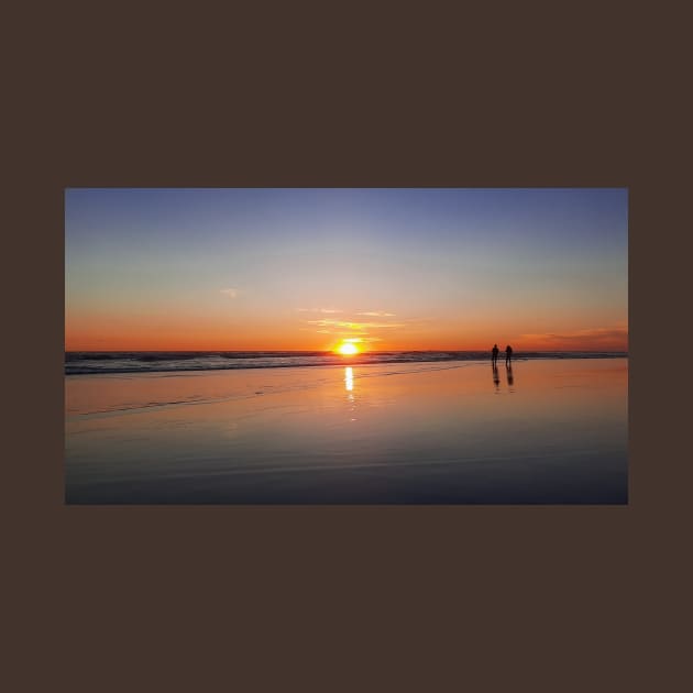 Silhouetted couple enjoys sunset at beach by kall3bu