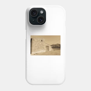 Old stone building with dilapidated wooden doors Phone Case